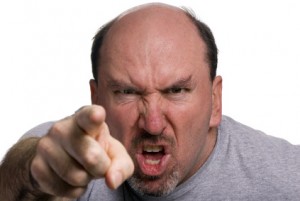A middle aged man very upset about something. Pointing his finger. Anger Management?